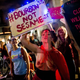 Strip club dancers, workers, and supporters march in in New Orleans to protest the recent police raids that cited and closed several strip clubs on Bourbon Street